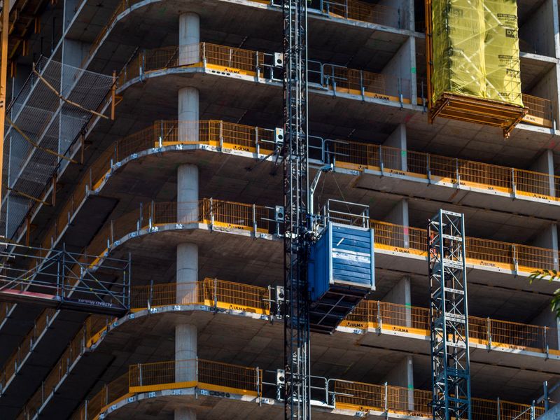 Scaffolding and facade detail on a masonry building under construction